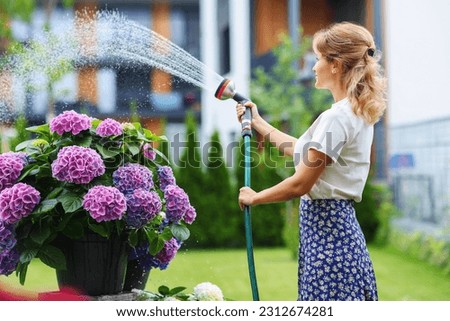 Image, Stock Photo Woman with water hose