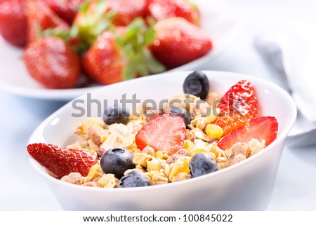 Breakfast with granola cereals and fresh berries