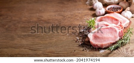 Similar – Foto Bild Rohes Schweinesteak auf einem Teller, Ansicht von oben. Steak isoliert auf blauem Hintergrund