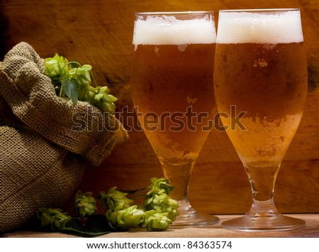 still life with glasses of beer and hops