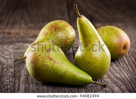 green pears on wooden table