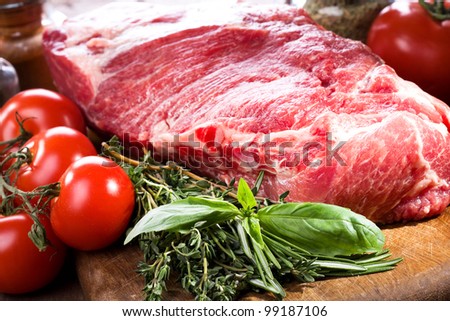 raw meat with different herbs and vegetables