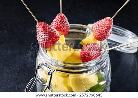 Similar – Image, Stock Photo A fresh strawberry skewered with a fork