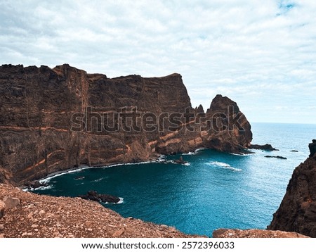Similar – Image, Stock Photo Shore with rough mountain ridge