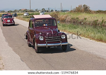 CERVIA (RA) ITALY - JUNE 2: unidentified driver on an old italianl car Fiat 500 Topolino with canvas sunroof at rally of vintage car \