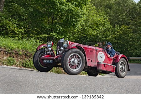 PASSO DELLA FUTA (FI), ITALY - MAY 18: unidentified drivers on an old car Mercedes-Benz SSK (1929) in rally Mille Miglia 2013, the famous historical race on May 18, 2013 in Passo della Futa (FI) Italy