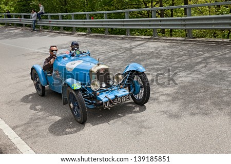 PASSO DELLA FUTA (FI), ITALY - MAY 18: unidentified drivers on an old car Rally ABC (1929) runs in rally Mille Miglia 2013, the italian historical race on May 18, 2013 in Passo della Futa (FI) Italy