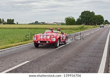RAVENNA, ITALY - MAY 17: unidentified drivers on the old racing car Ferrari 500 Mondial  (1955) in rally Mille Miglia, the famous italian historical race (1927-1957) on May 17, 2013 in Ravenna, Italy