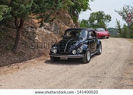 FOGNANO (RA), ITALY - JULY 7: unidentified crew on a vintage car Volkswagen Type 1 (Beetle) runs on a dirt road during the rally \