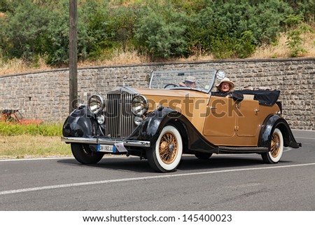 FOGNANO (RA), ITALY - JULY 7: crew on a classic car Rolls-Royce Wraith Convertible (1938) travel in the italian hill during the rally \