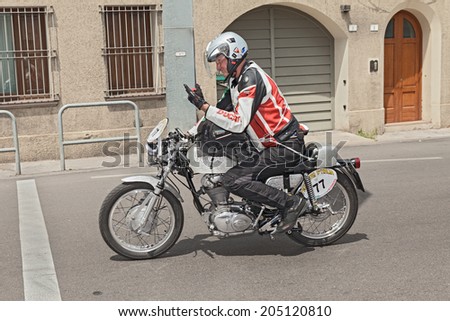FORLI\', ITALY - JUNE 6: the biker Richard Tewes rides a vintage motorcycle Ducati 450 Silver Shot Gun (1971) at the historic rally \