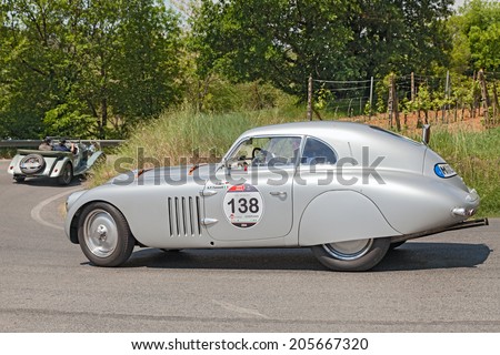 COLLE DI VAL D\'ELSA, SI, ITALY - MAY 17: the crew Jung - Fumanelli on a vintage racing car BMW 328 Berlinetta Touring (1939) in race Mille Miglia on May 17 2014 in Colle di Val d\'Elsa, Tuscany, Italy