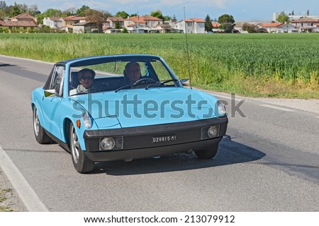 CAMPIANO (RA), ITALY - APRIL 28: unidentified crew on a vintage italian car Fiat X1/9 at the rally for classic cars  \