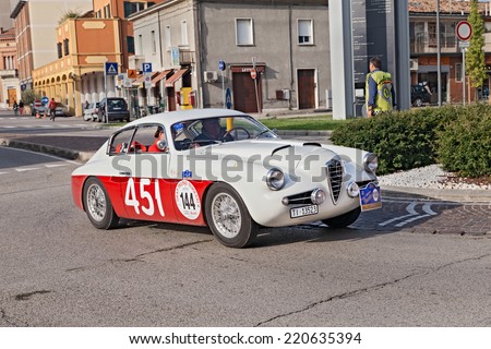 LUGO, RA, ITALY - SEPTEMBER 21: the crew Carlini - Martegani on a vintage racing car Alfa Romeo 1900 SSZ Zagato (1955) in historic race 