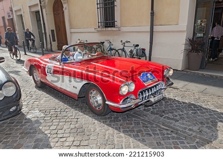 LUGO, RA, ITALY - SEPTEMBER 21: the crew P. Van Hest H. Brogli on a vintage car Chevrolet Corvette C1 (1960) in classic cars rally \