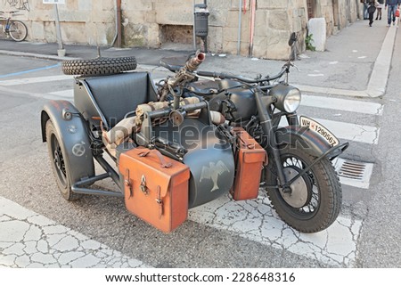 FAENZA, ITALY - NOVEMBER 2: old sidecar motorcycle BMW R75 750 cc armed with a machine gun, at the military vehicle rally during the festival \