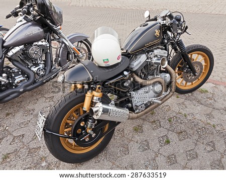 FORLIMPOPOLI, ITALY - JUNE 15: custom motorbike Harley Davidson Sportster cafe racer in rally of vintage and custom car and motorcycle \