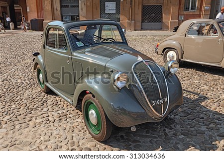 LUGO, RA, ITALY - AUGUST 30: old italian small car Fiat 500 B Topolino Trasformabile (1949) parked during the classic car, motorcycle and bicycle rally, on August 30, 2015 in Lugo, Ravenna, Italy