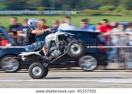 KATOWICE, POLAND- SEPTEMBER 24: Unidentified quad rider performs at Mobil1 Summer Cars Party 2011 RACE & MUSIC on September 24, 2011 in Katowice, Silesia, Poland.