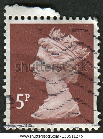UK-CIRCA 1993: A stamp printed in UK shows image of Elizabeth II is the constitutional monarch of 16 sovereign states known as the Commonwealth realms, in dull red-brown, circa 1993.