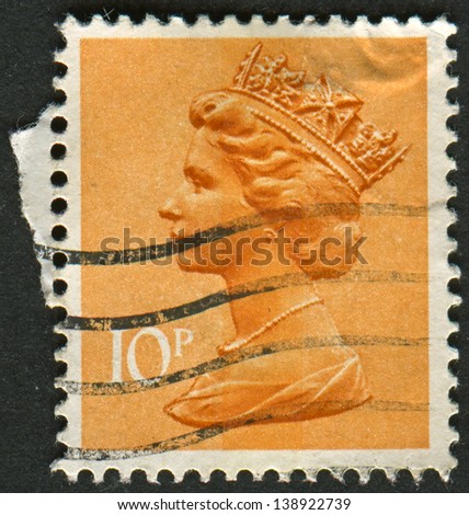 UK-CIRCA 1993:A stamp printed in UK shows image of Elizabeth II is the constitutional monarch of 16 sovereign states known as the Commonwealth realms, in dull orange, circa 1993.