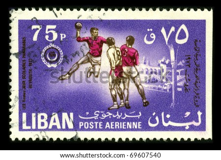 LEBANON-CIRCA 1973:A stamp printed in LEBANON shows image of the Handball is a team sport in which two teams of seven players each pass a ball to throw it into the goal of the other team circa 1973