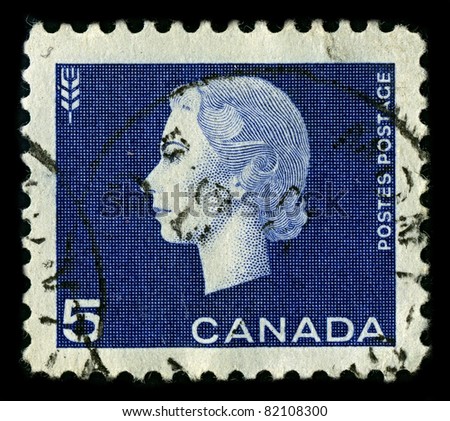 CANADA-CIRCA 1962:A stamp printed in CANADA shows image of Elizabeth II (Elizabeth Alexandra Mary, born 21 April 1926) is the constitutional monarch of United Kingdom in blue, circa 1962.