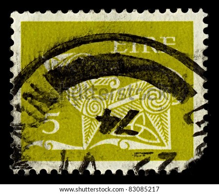 IRELAND-CIRCA 1974:A stamp printed in IRELAND shows image of The dog, in the form of decorative brooches, circa 1974.
