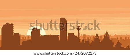 Brown panoramic poster of the city skyline with misty background buildings, sunrise, clouds and mountains of LIVERPOOL, UNITED KINGDOM