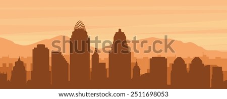 Brown panoramic poster of the city skyline with misty background buildings, sunrise, clouds and mountains of CINCINNATI, UNITED STATES