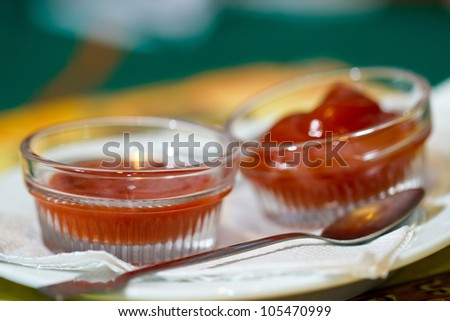 Tomato and chili sauce with spoon for a good taste