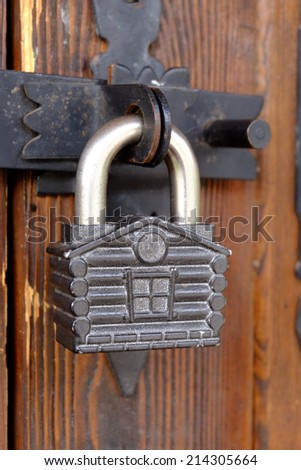 Old lock shaped like a house.