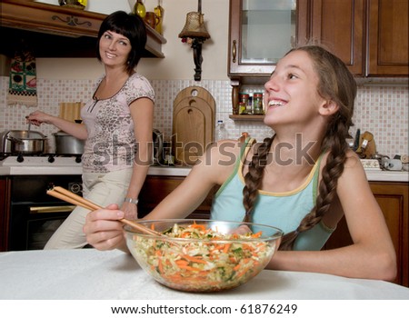 Mother and daughter cooking happy