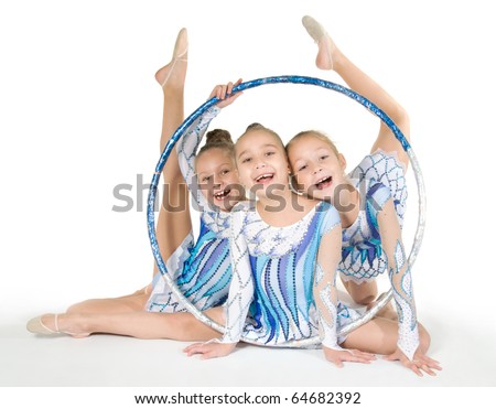 Little beautiful gymnasts with the hoop