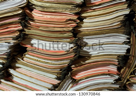 Stack of documents, papers and full binders