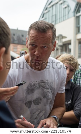 ASCHAFFENBURG, GERMANY -SEPTEMBER, 2014: German former boxing champion Henry Maske at a autograph session for fans on September 20, 2014 in Aschaffenburg, Germany