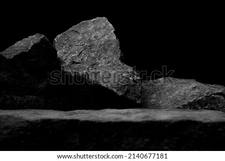 A Blurred Foreground Rock Shelf for a Product Display, Showing Selective Focus to the Background Stones with Natural Worn Texture with Close Detail to the Ancient Small Boulders. Stock foto © 