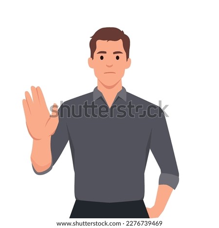 Trendy young business man making or showing stop gesture sign with hand, saying no. Shocked person warning signal with palm of the hand. Human emotions and modern lifestyle. 