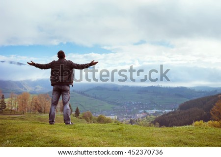 Image, Stock Photo Man admiring mountain landscape from wooden footbridge