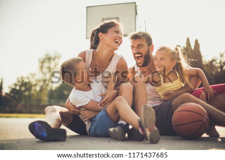 Similar – Image, Stock Photo Ethnic father playing with child on ground