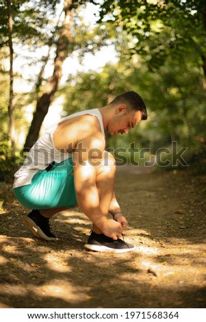 Similar – Foto Bild Seriöser Mann beim Schnüren von Stiefeletten