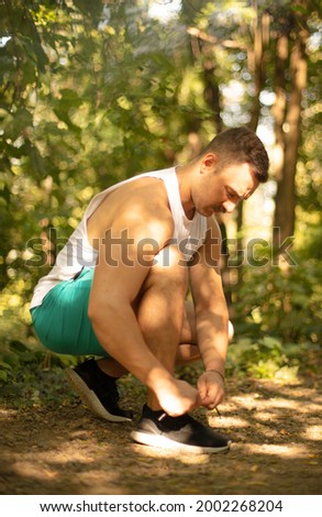 Similar – Foto Bild Seriöser Mann beim Schnüren von Stiefeletten