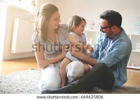 Similar – Image, Stock Photo Happy family. Father playing with her baby boy infant oudoors on sunny autumn day. Portrait of dad and little son on wooden platform by lake. Positive human emotions, feelings, joy.