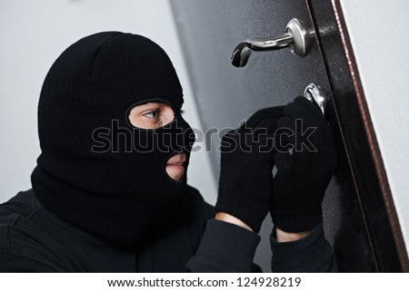 Thief Burglar Force Lock Metal Door With A Tool During House Breaking ...