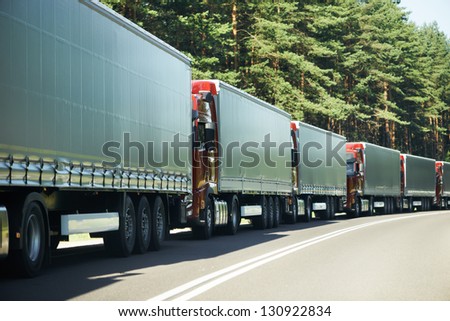 Lorry trucks cars in traffic jam at border zone custom
