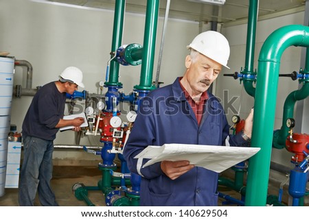 maintenance repairman engineer of heating system equipment in a boiler house