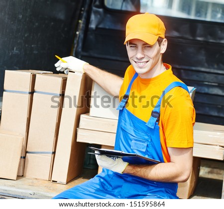 young male postal delivery courier man in front of cargo van delivering package