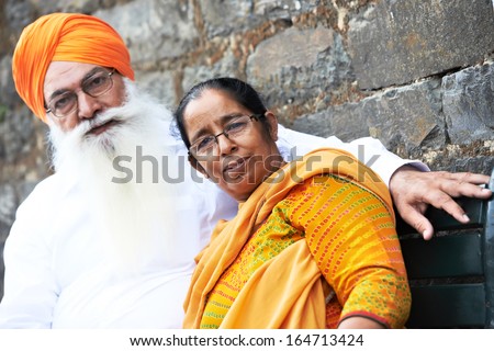 Portrait of elderly Indian sikh man in turban with bushy beard