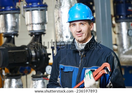 industrial construction worker plumber  at boiler room
