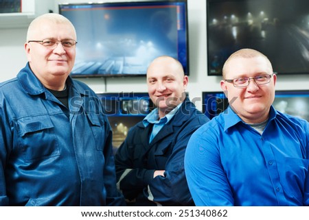 security executive chief in front of video monitoring surveillance security system team